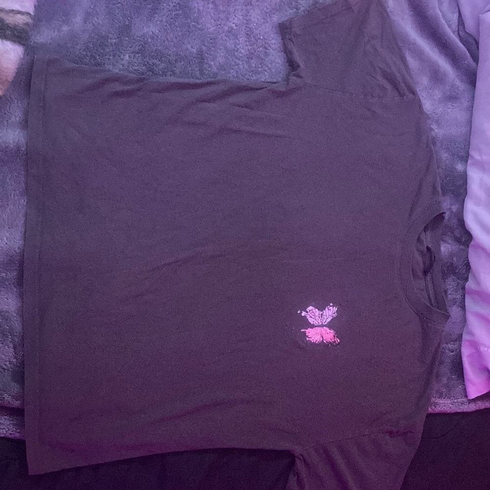 I am selling a SHEIN shirt that’s brown, with pink and black on butterflies.